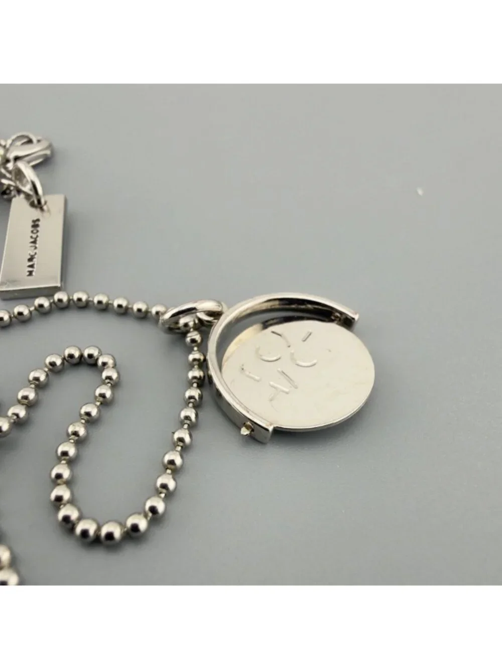 Marc Jacobs Spinner Pendant Charm Necklace P.S. I Love You Message Silver Tone